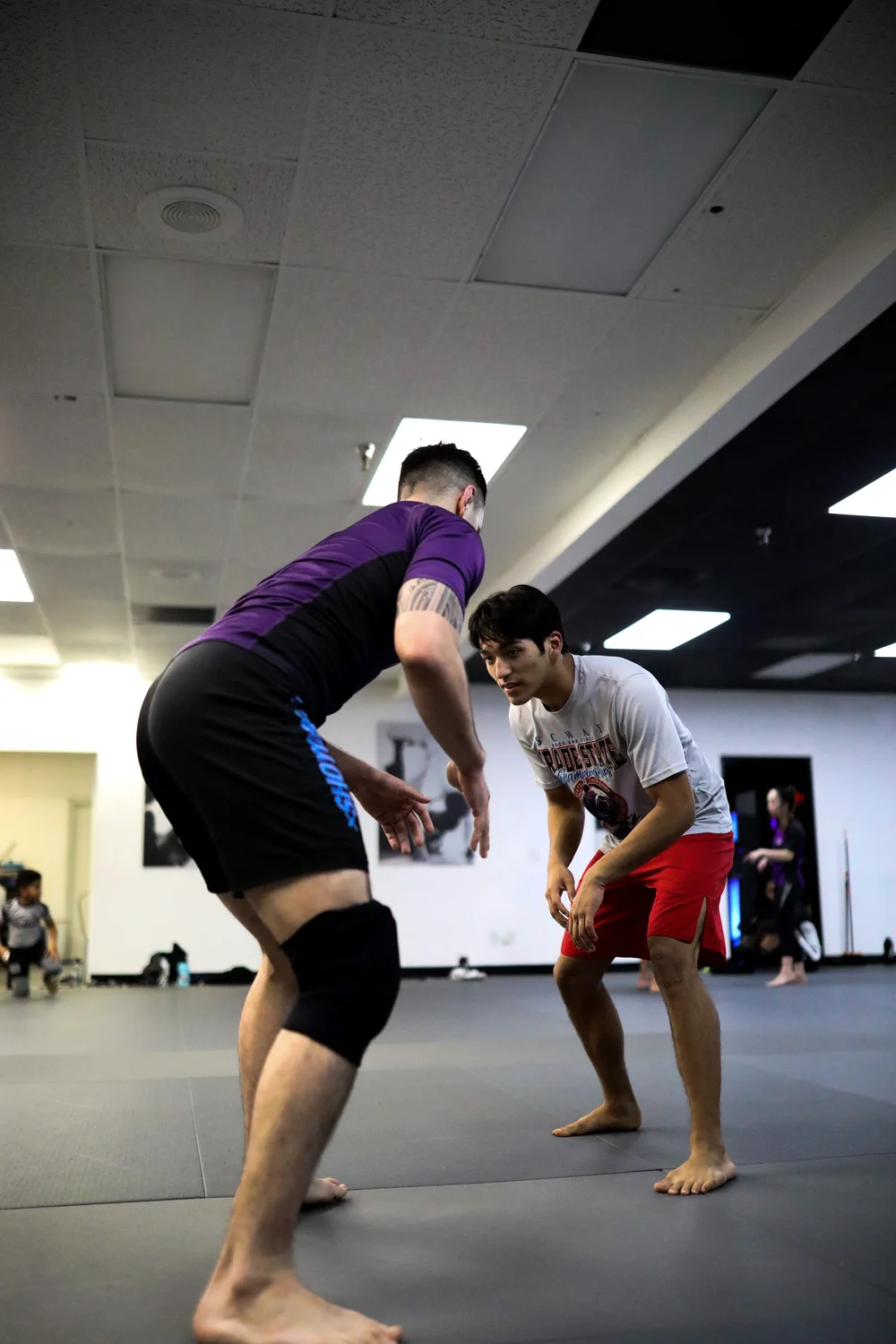 Wrestling class practicing a takedown