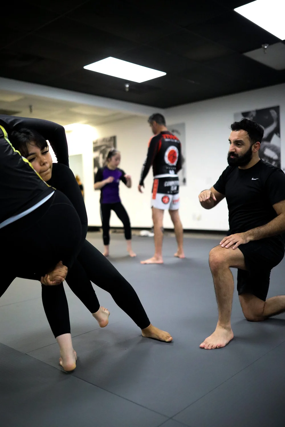Wrestling students drilling top position control
